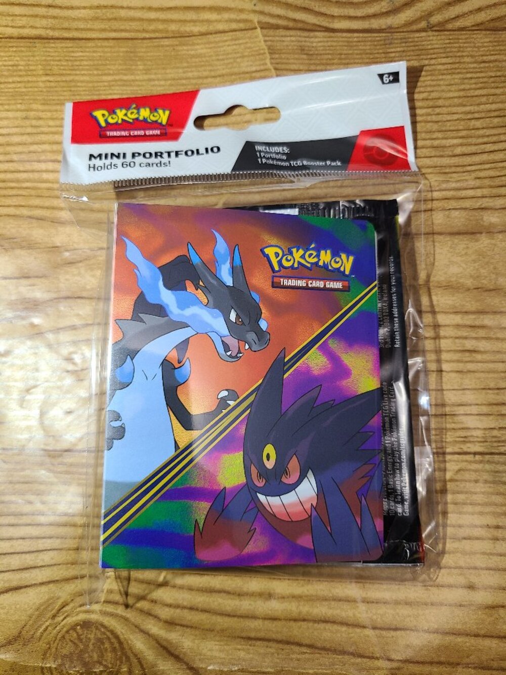 Pokemon mini portfolio with 1 Phantasma;l Flames TCG booster pack (NEW)